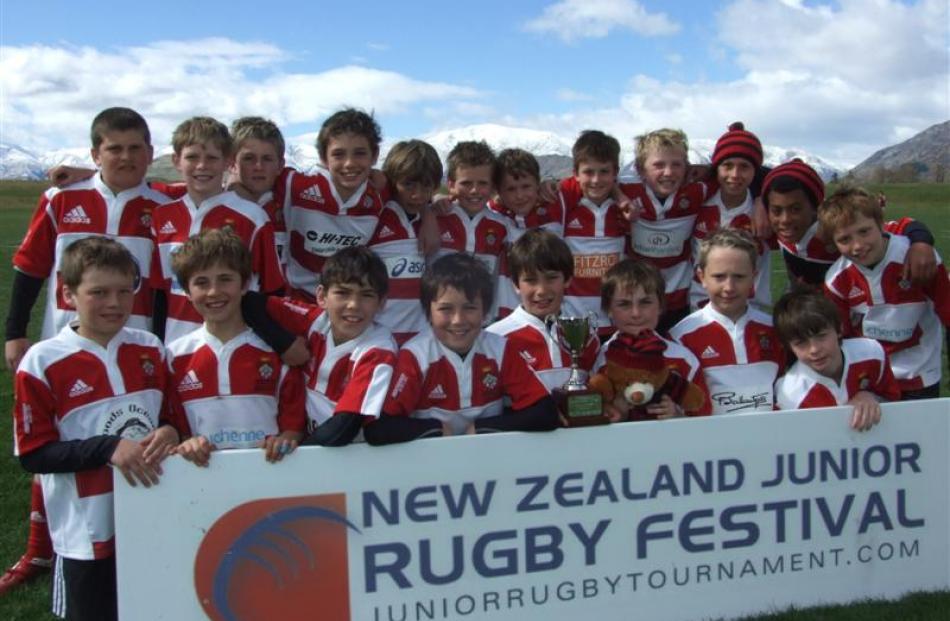 Victorious Under-11 team Christchurch Gold took home the cup after a 34-0 triumph over fellow...