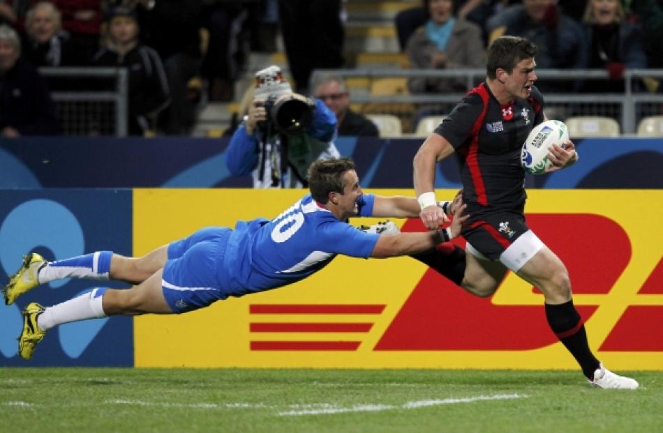 Namibia's Theuns Kotze (left) fails to prevent Wales' Scott Williams from scoring during their...