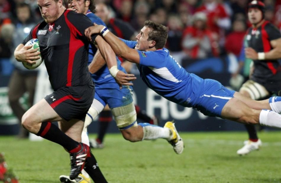 Namibia's Theuns Kotze (right) attempts to tackle Wales' Gethin Jenkins during their Rugby World...