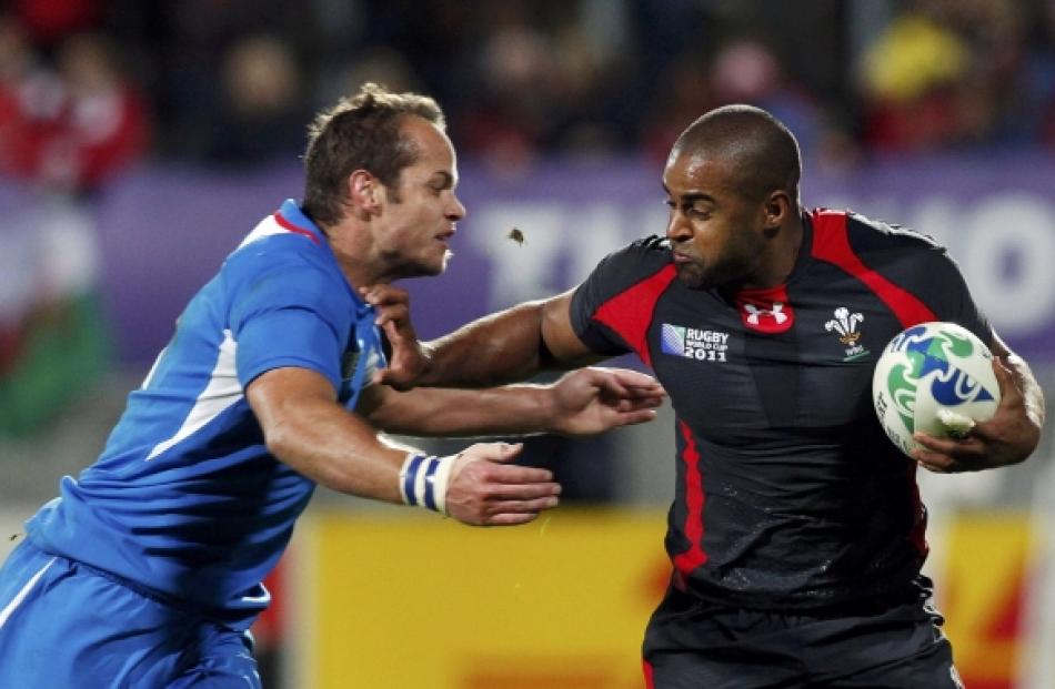 Wales' Aled Brew (right) fends off Namibia's Danie Dames during their Rugby World Cup Pool D...