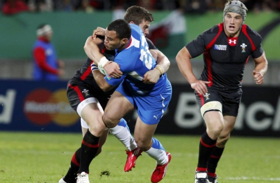 Wales' Scott Williams (left) tackles Namibia's David Philander during their Rugby World Cup Pool...