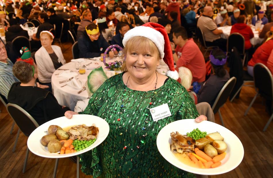 Dunedin Community Christmas Dinner co-ordinator Anne Hardy prepares to serve Christmas dinner.
