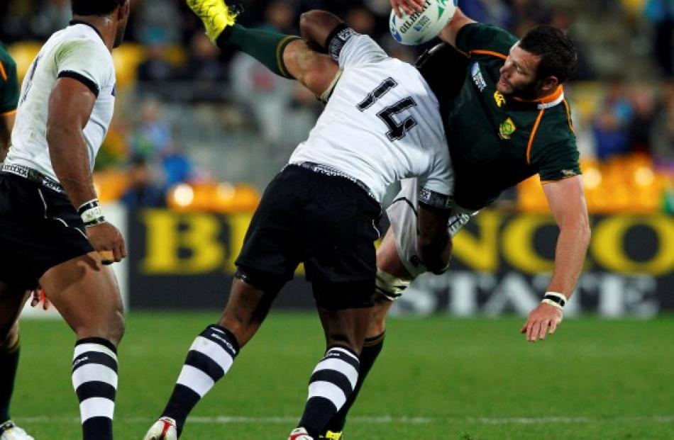 Fiji winger Vereniki Goneva stops the Springboks' Danie Rossouw.