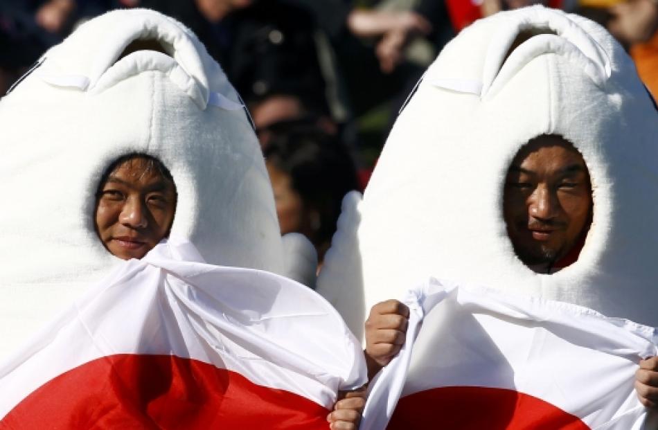 Japan fans pose for a picture before their Rugby World Cup Pool A match against Canada at McLean...