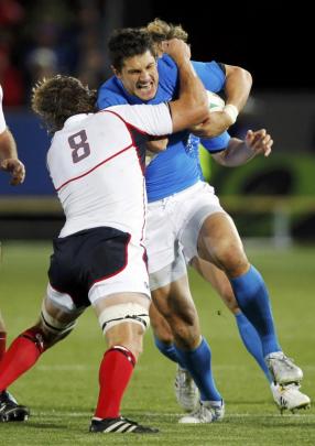 Nic Johnson (left) of the US tackles Italy's Alessandro Zanni during their Rugby World Cup Pool C...