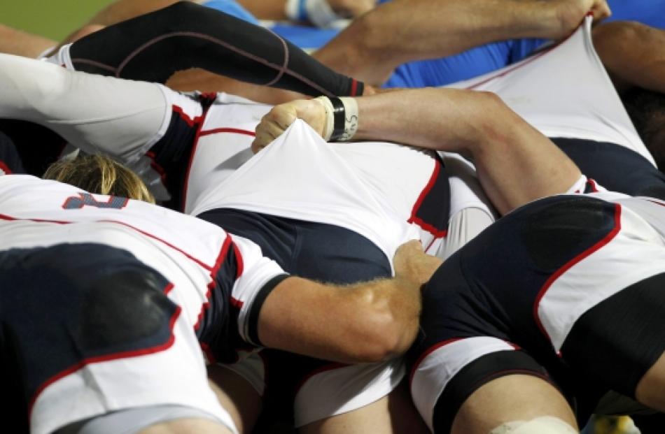 US forwards contest a scrum against Italy during their Rugby World Cup Pool C match at Trafalgar...