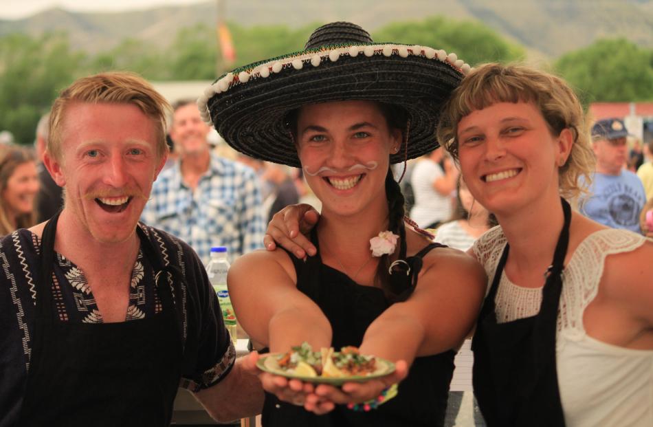 Williburto's staff William Nehoff, left, Barbora Grygarova, and Isabell Muehlenbeyer serve up Mexican fare at the Kurow Festival Market day yesterday. Photos: Hamish Maclean.