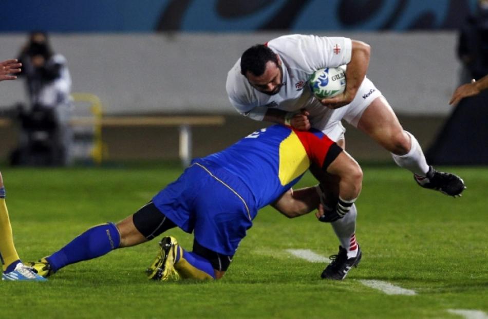 Romania captain Marius Tincu (left) tackles Georgia's David Zirakashvili during their Rugby World...