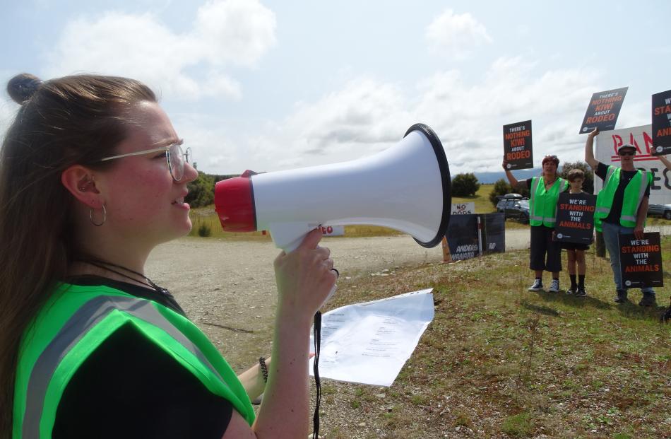 Kat Gollop of the Queenstown Vegan Society and 10 supporters protest at the entrance to the...