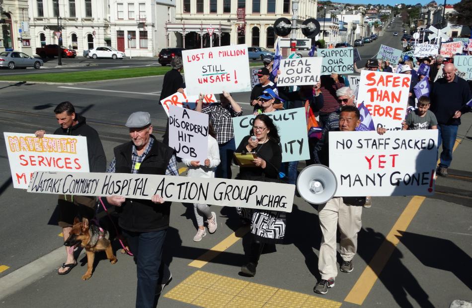 Members of the Waitaki Community Hospital Action Group make their way along lower Thames St...