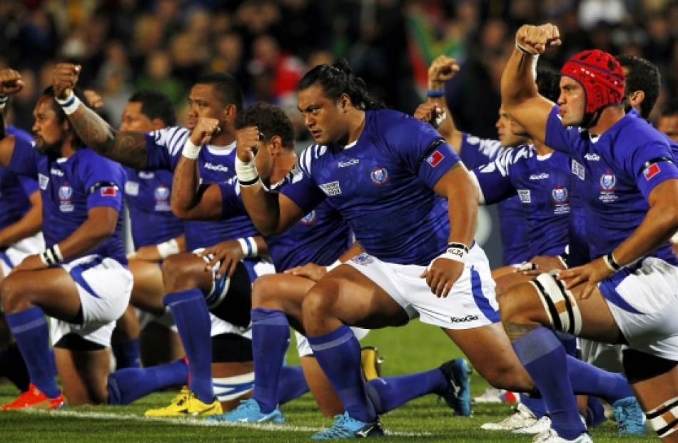 Samoa players perform the Siva Tau before their Rugby World Cup Pool D match against South Africa...