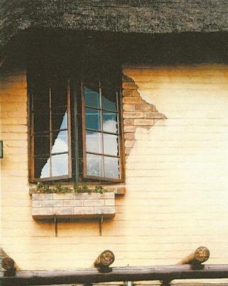 The aged look around this window on a house in South Africa was created by Maass, as part of a...