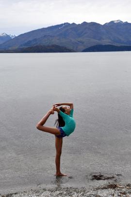 Issy Brockie (11) practises her yoga moves at Lake Wanaka. Photo: Rajinder Bassi