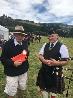 Horse convener Keith Vogan (left), of Duvauchelle, chats to lone piper Glen Vickery, of the...