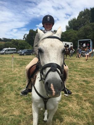 Lizzie Wright (11), of Little River, and her horse Wombat are ready to compete in the jumping...