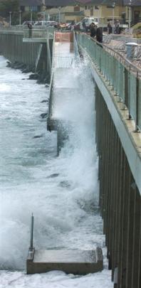 The sea surges around the damaged ramp in 2005.