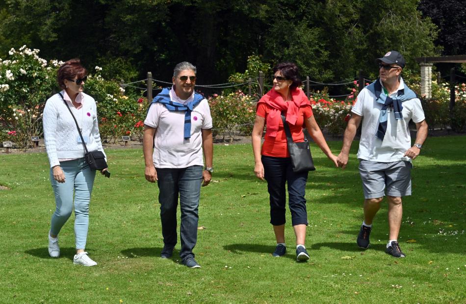 Wandering through the Dunedin Botanic Garden are Ovation of the Seas passengers (from left)...