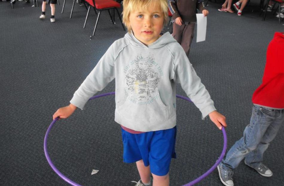 Oliver Little (7), of Arrowtown, shows off his Hula-Hoop skills for the camera.