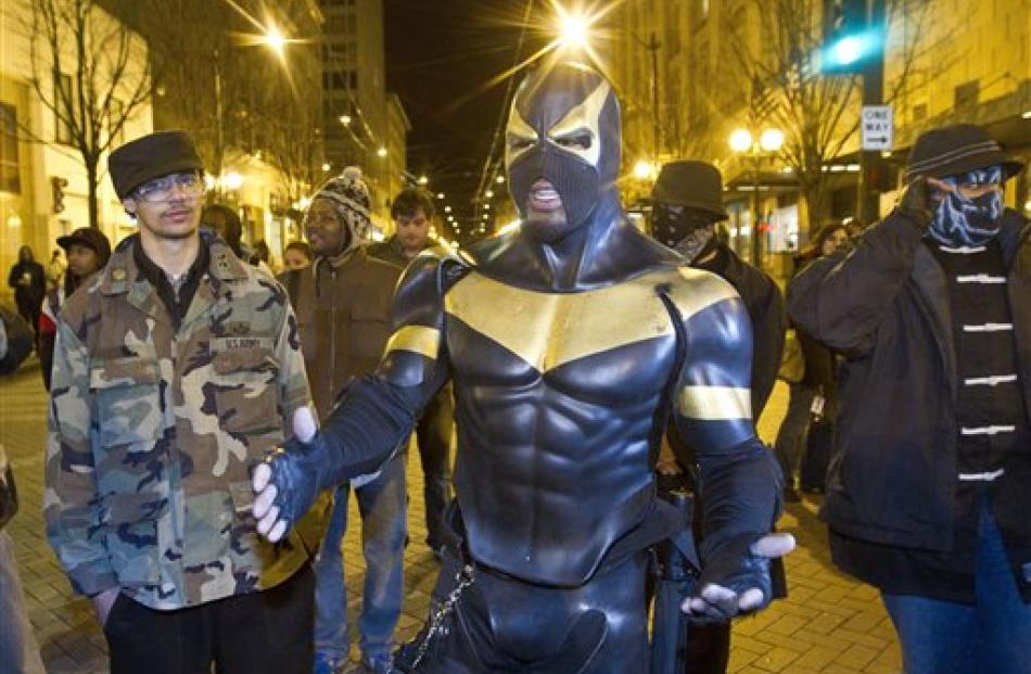 Phoenix Jones meets protestors at Westlake Park in Seattle as a rally against police brutality...