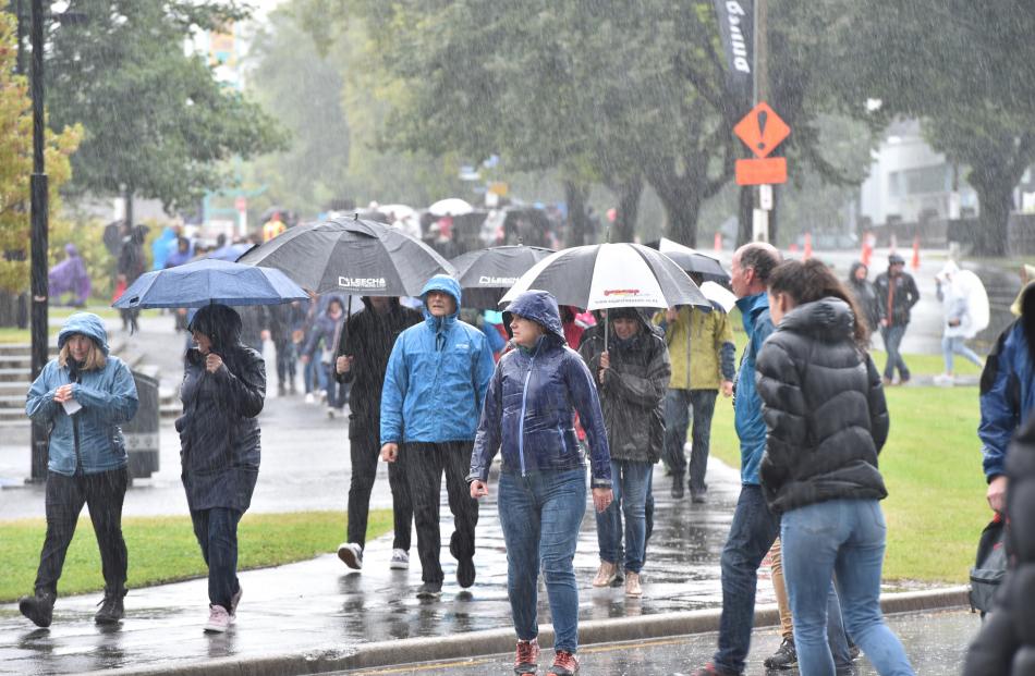 Concert-goers make their way along Anzac Ave to Forsyth Barr Stadium this evening. Photo: Gregor...