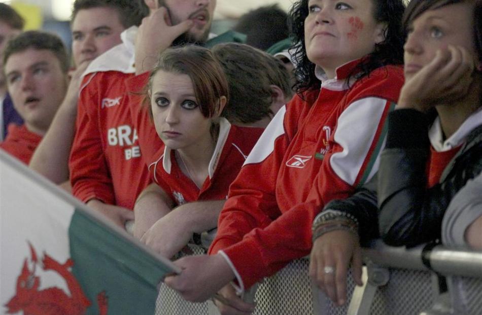 Fans watch the tense encounter.  REUTERS/Olivia Harris