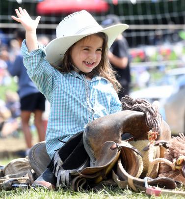 Jenna Jowett (3) takes a turn on the cowboy saddle. PHOTOS: STEPHEN JAQUIERY