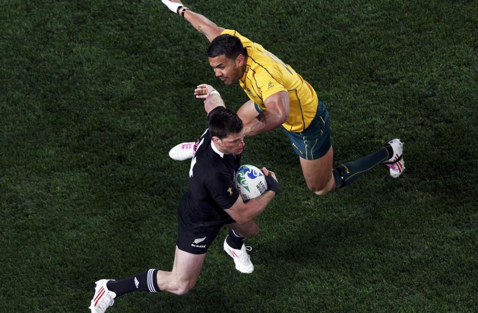 Cory Jane avoids the tackle of Digby Ioane. REUTERS/Nigel Marple