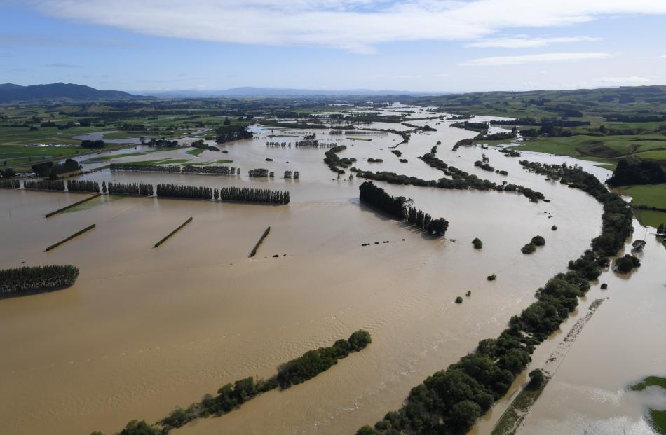 The Mataura River flows across farmland near Gore.