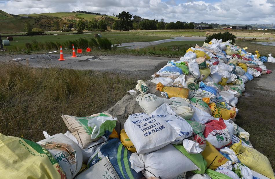 Sandbags sit dry after the floodwater receded on Thursday.