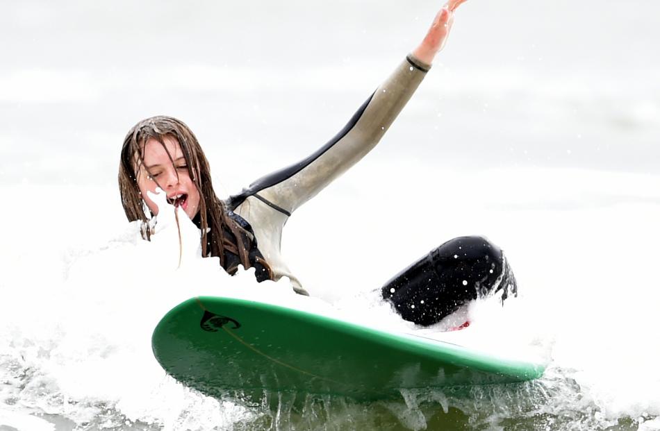 Isobelle Grey (12) takes a tumble from her surfboard.
