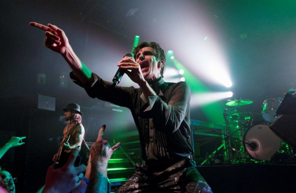 Singer Perry Farrell of Jane's Addiction performs with guitarist Dave Navarro (L) during a...