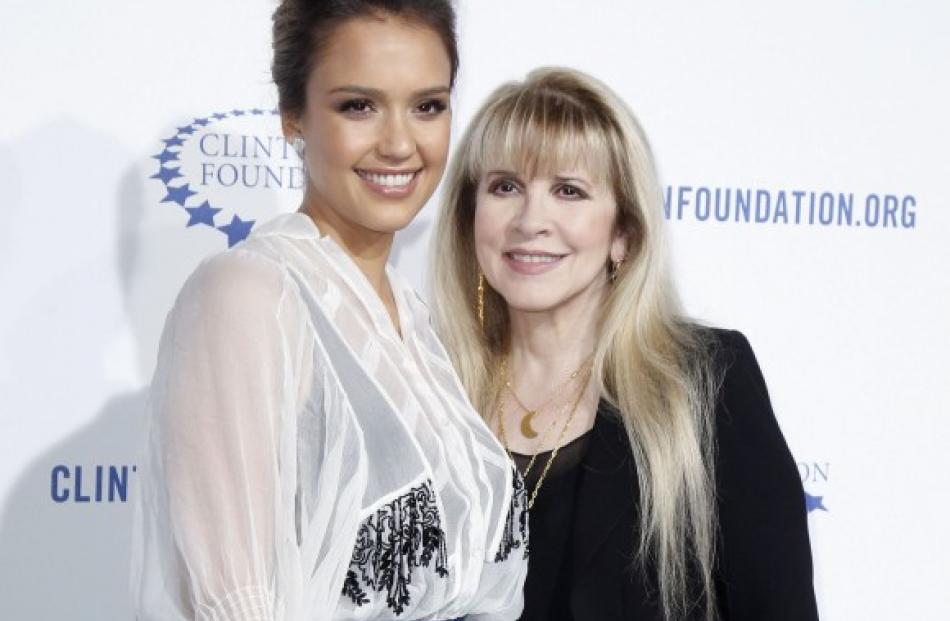 Actress Jessica Alba (L) and singer Stevie Nicks pose at The Clinton Foundation Gala in...