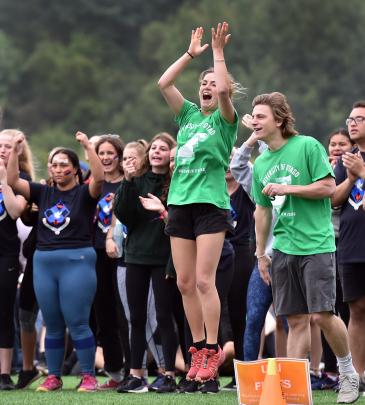 Arabella McLeay (22), of University Flats, cheers for her team during the relay at the Otago...