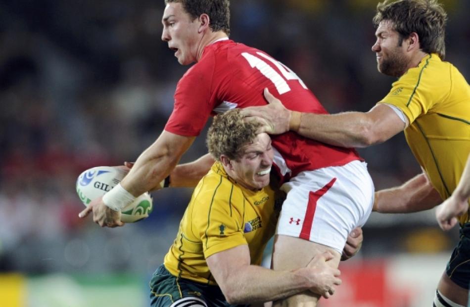 Australia Wallabies' David Pocock (L) tackles Wales' George North during their Rugby World Cup...