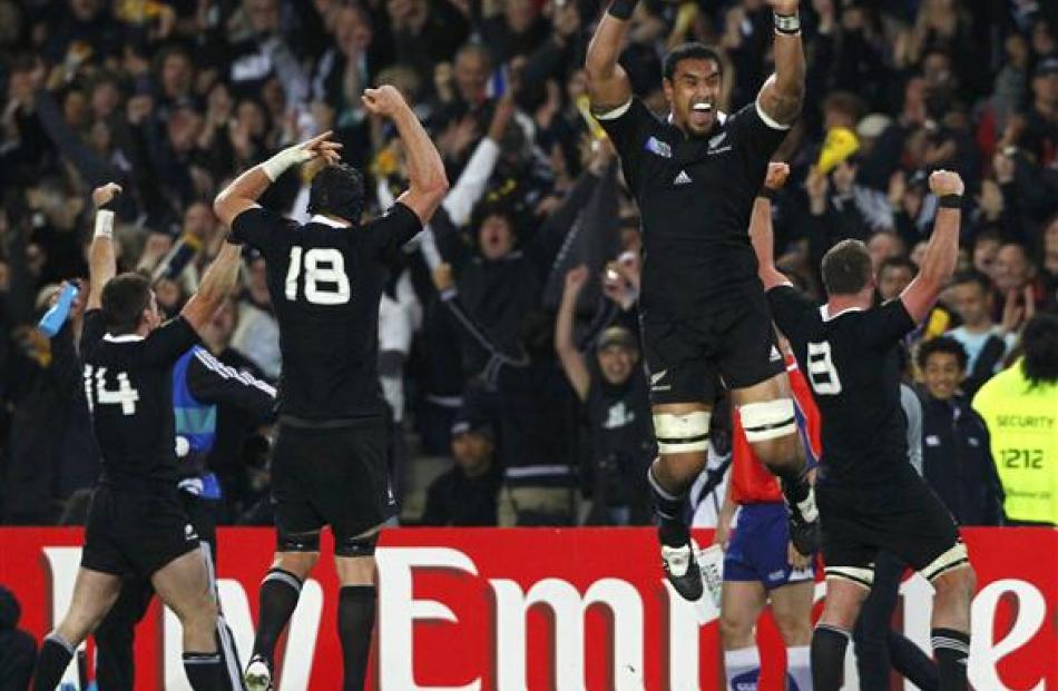 The All Blacks jumpo for joy at the final whistle. Photo Reuters