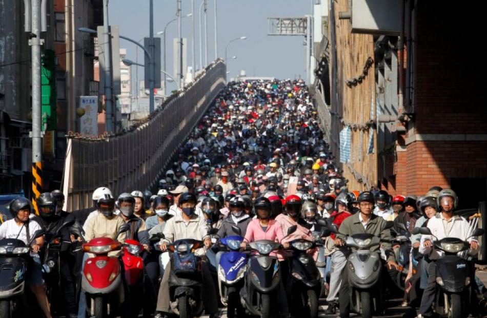 Motorists crowd at a junction during rush hour in Taipei. REUTERS/Nicky Loh/Files