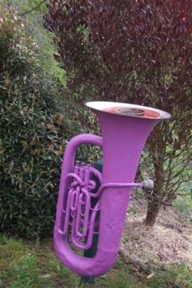 A tuba has been recycled as a bird feeder in the Scott garden.