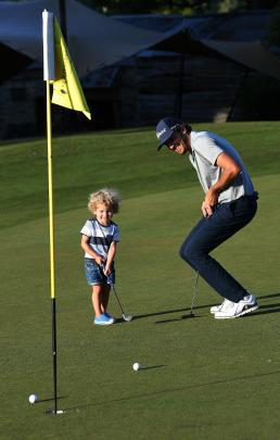 Family man . .. Australian golfer Matt Jager, who won the Australian Amateur in 2010, with son...