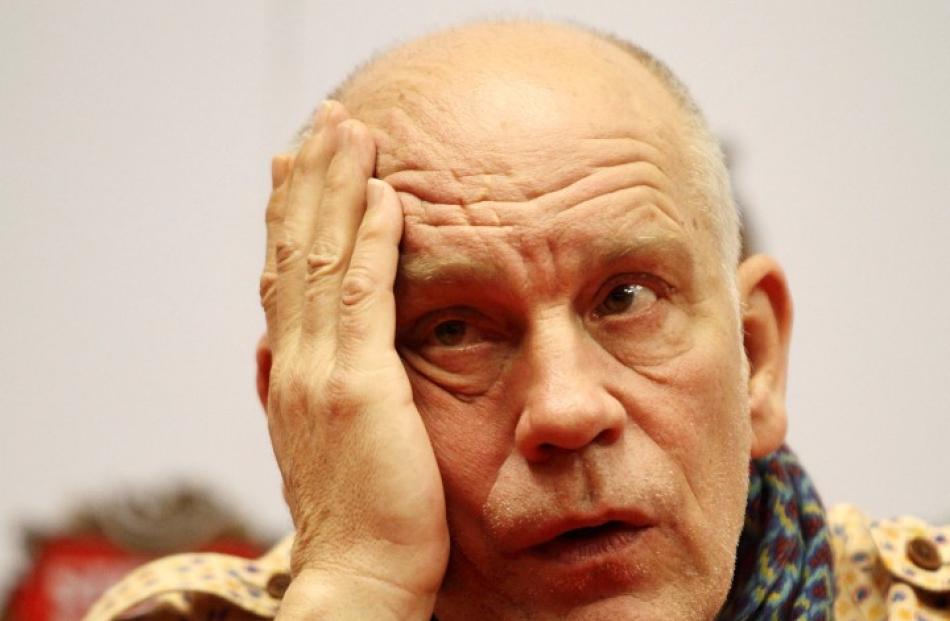 John Malkovich speaks during a news conference in Lima. Malkovich is in Peru to perform in the...