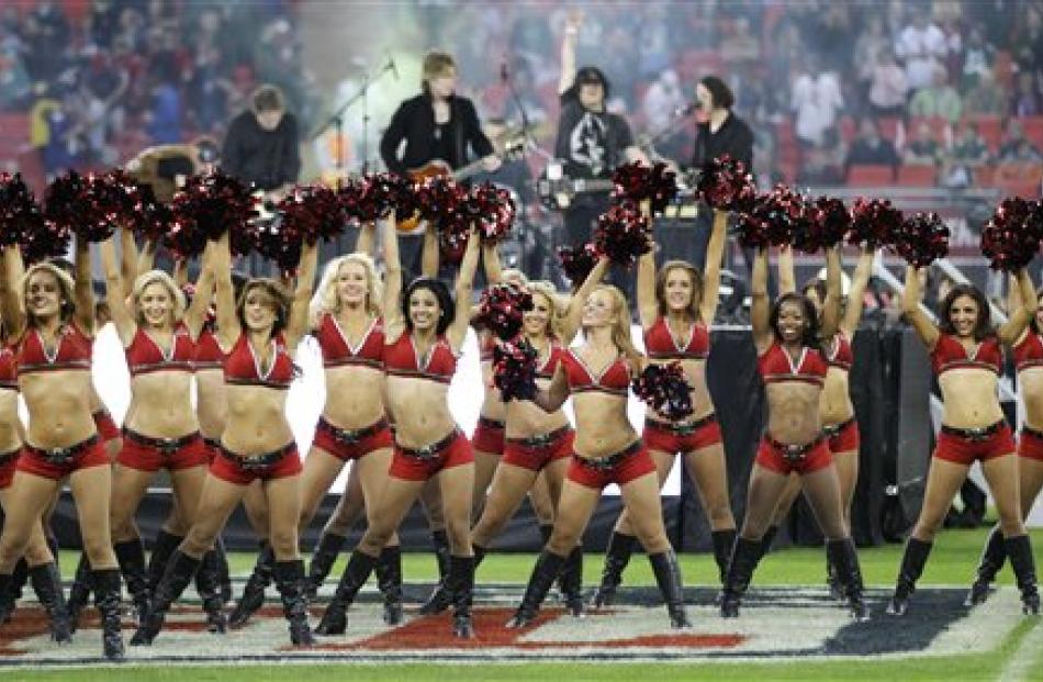 Tampa Bay Buccaneers cheerleaders perform in front of the Goo Goo Dolls during the first half of...