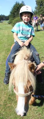 Rocky the miniature horse gave Jaxon Murch his first riding experience at the Family Fun Day.
