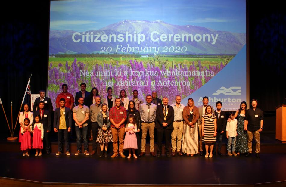 The 28 new citizens lined up at the end of the official ceremony.
