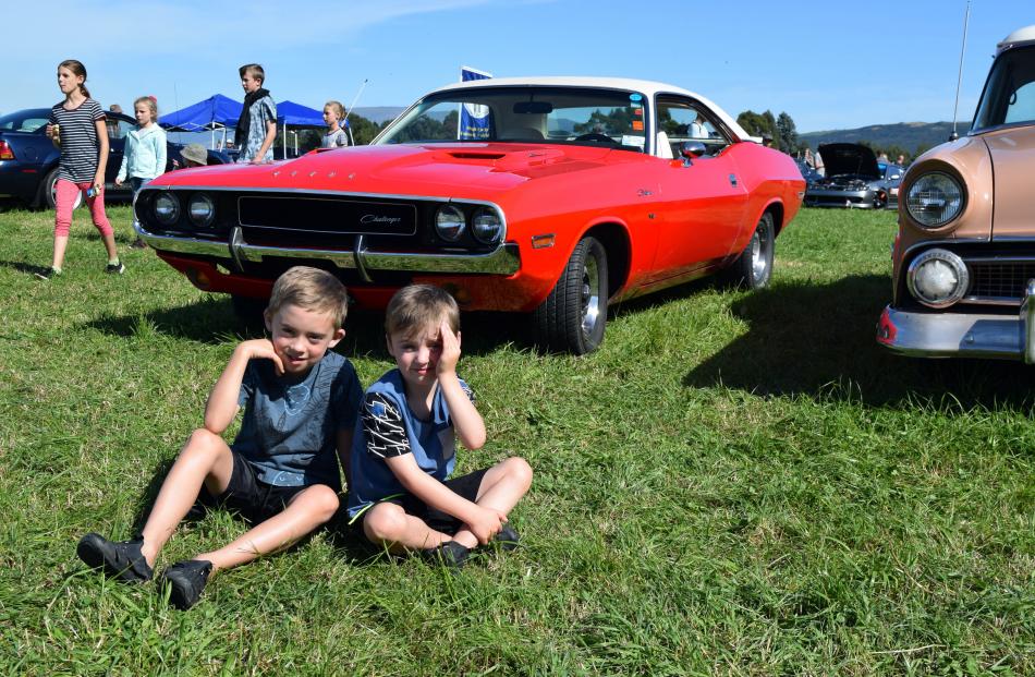 Brothers Harley (7) and Jordan (5) Richardson, of Mosgiel, relax by a 1970 Dodge Challenger.