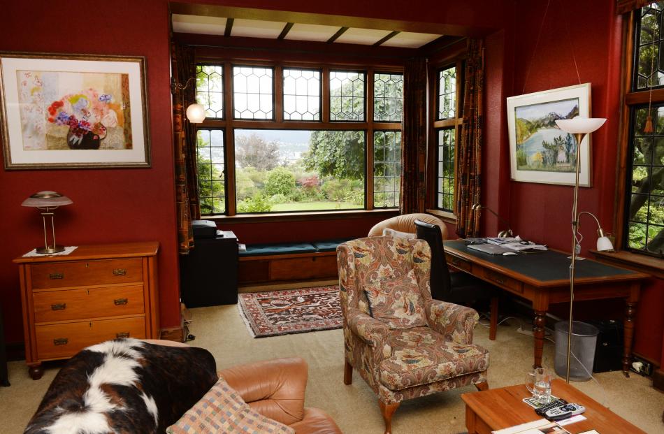 The snug was once a smoking room. Both paintings are by Annie Baird. 