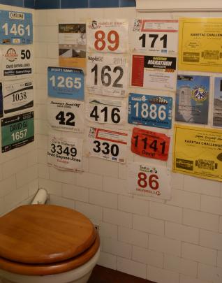 Race numbers are a playful touch in the downstairs toilet. Mr Gwynne-Jones competes in multisport...