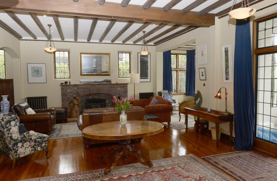 In the drawing room, the owners removed white from the brick fireplace and uncovered the two...
