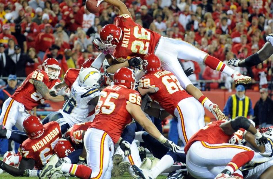 Kansas City Chiefs running back Jackie Battle dives over the pile for a touchdown against the San...