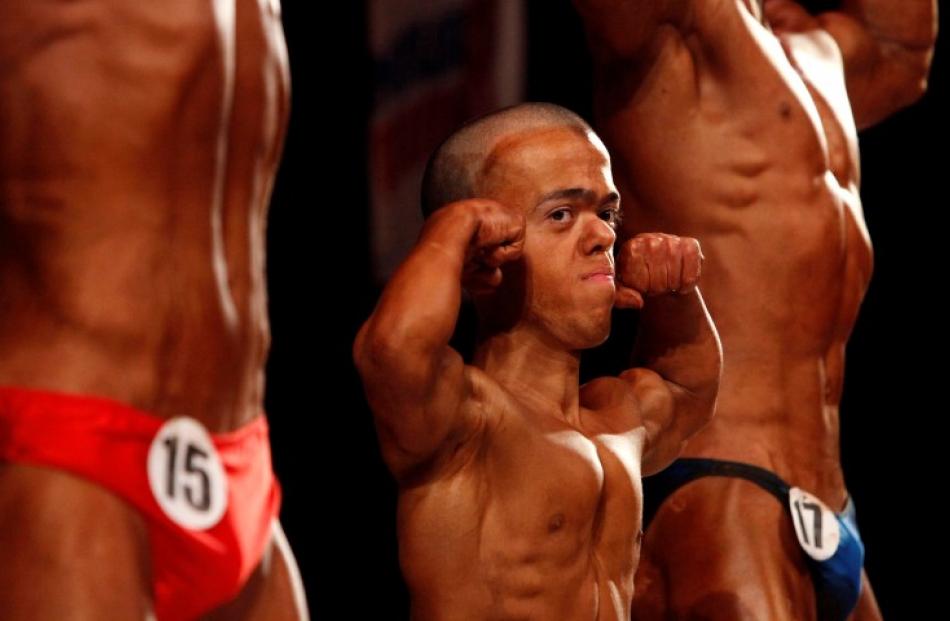 Participants take part in the 'Iron League' bodybuilding and body fitness regional tournament in...