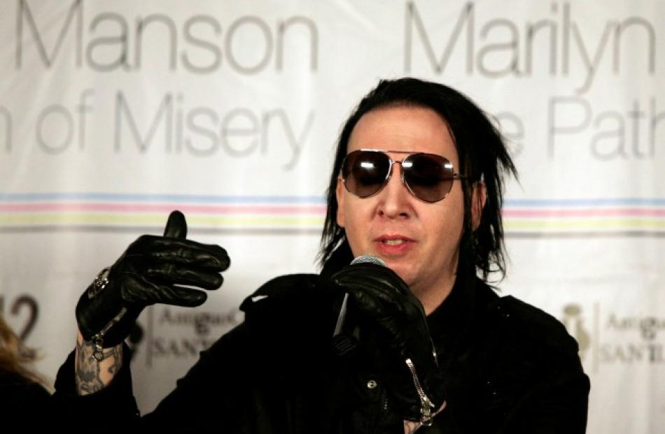 Musician Marilyn Manson speaks during a news conference about his art exhibit 'The Path of Misery...