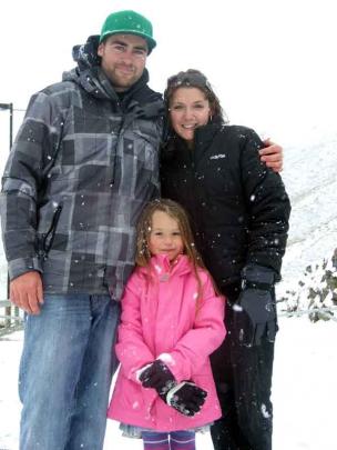 Ben Thatcher, of Queenstown, Emelia Thatcher (4) and Melissa Parker, both of Auckland, take a...